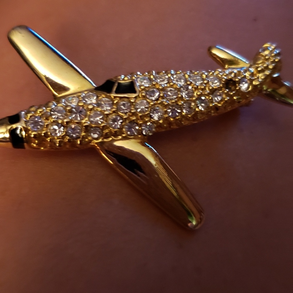 Gold jewelry Airplane Pin.
